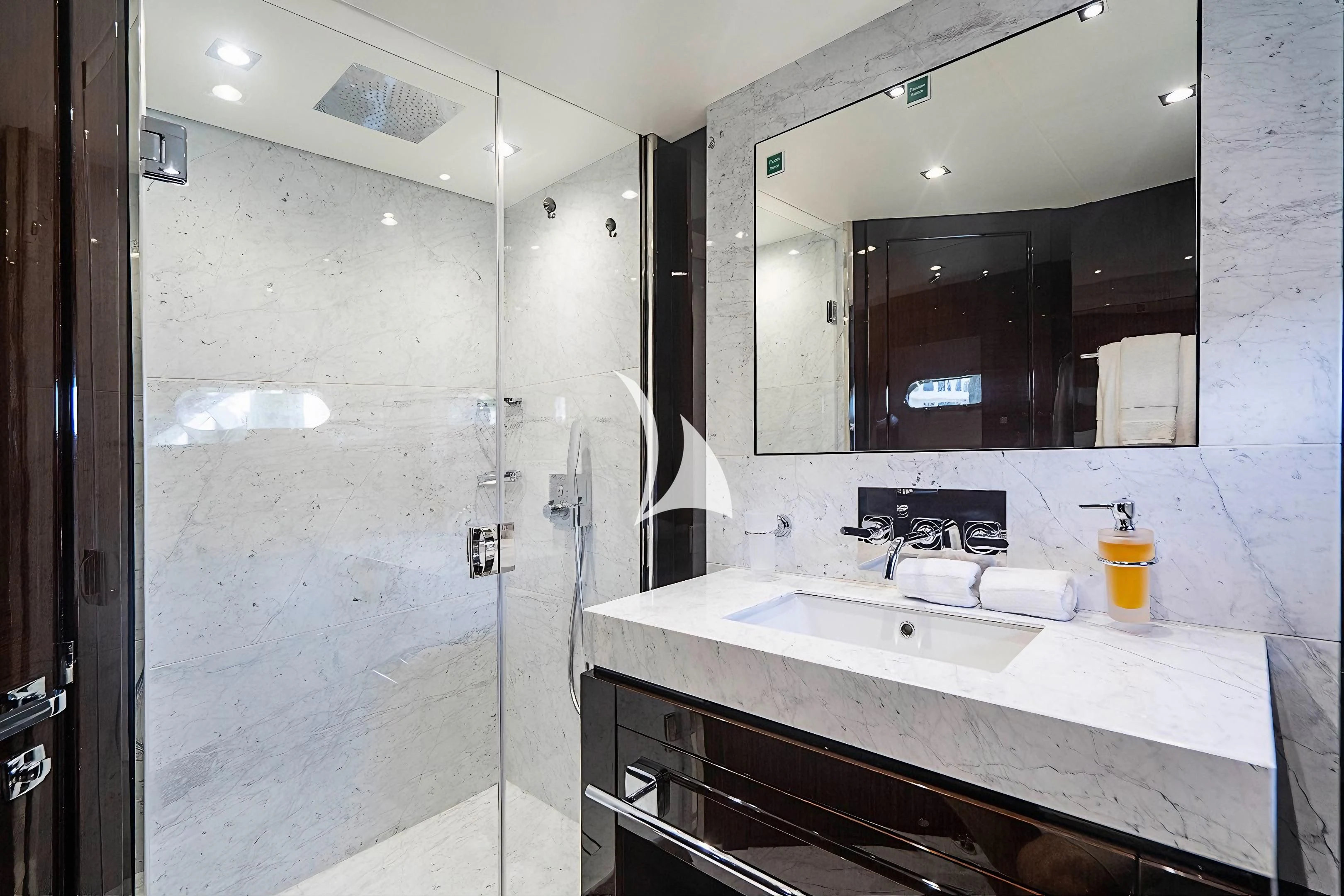 a bathroom with a large mirror aboard QUANTUM Yacht for Sale