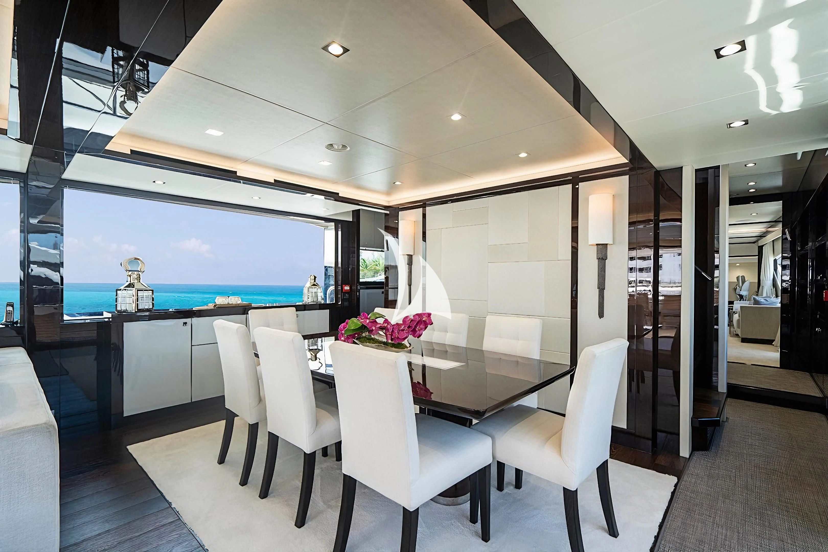 a room with white chairs and a table with a large window aboard QUANTUM Yacht for Sale