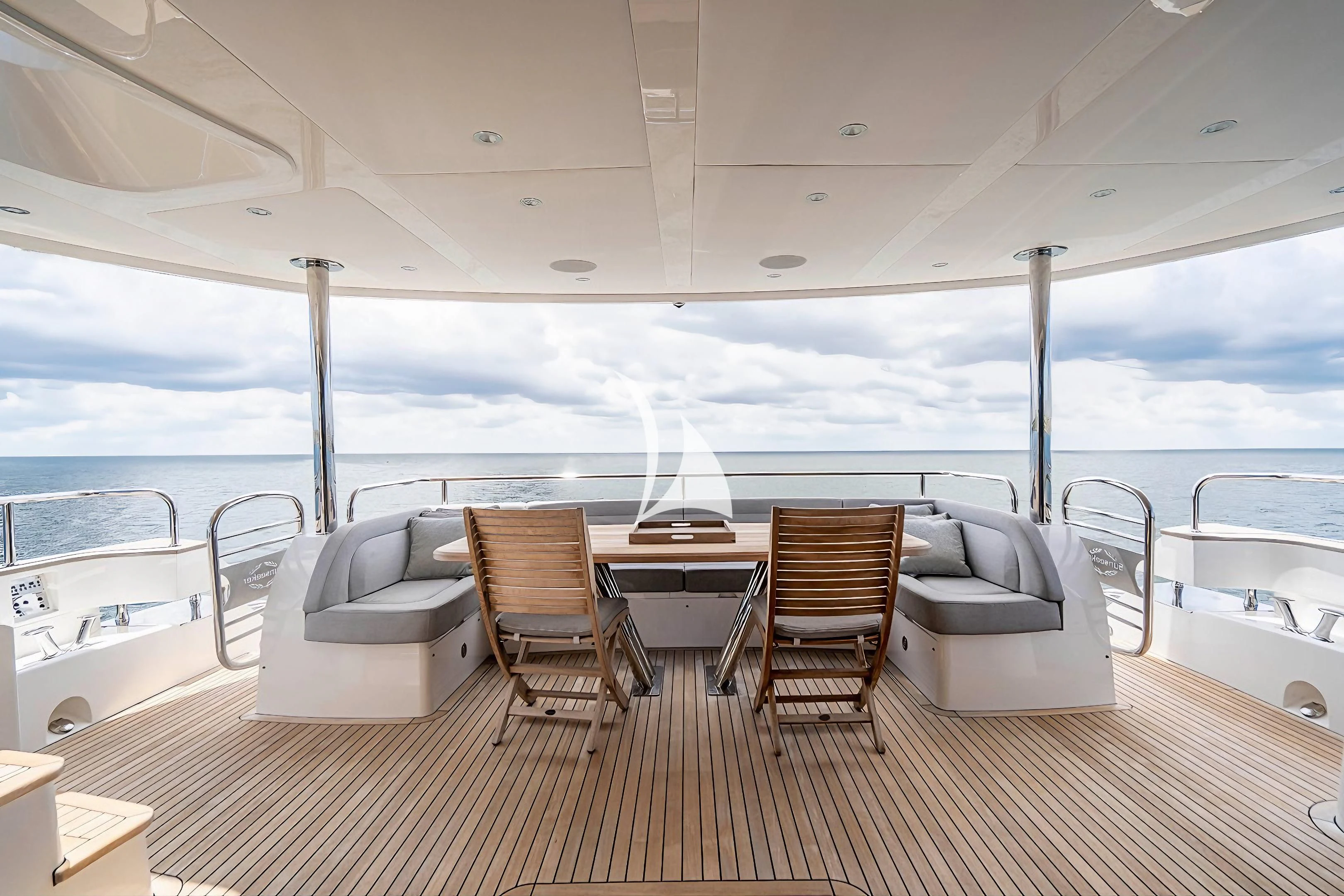 a room with a table and chairs aboard QUANTUM Yacht for Sale