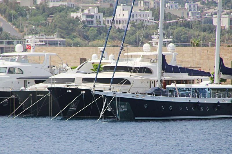 a boat docked at a pier aboard VOLARE Yacht for Sale