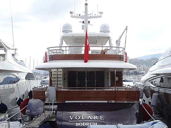 a boat with a red stripe on the front aboard VOLARE Yacht for Sale