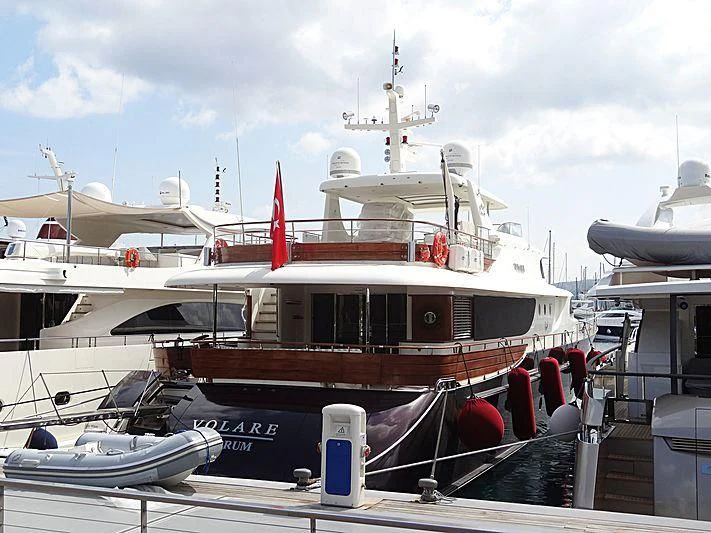 a boat docked at a pier aboard VOLARE Yacht for Sale