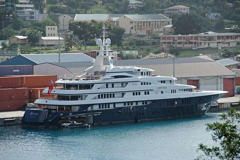 a large cruise ship docked aboard FREEDOM Yacht for Sale