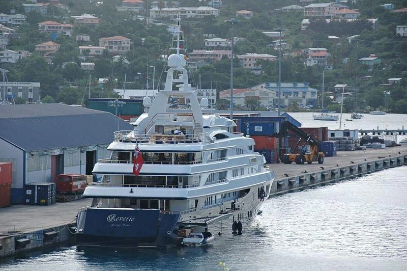 a large white boat docked at a pier aboard FREEDOM Yacht for Sale