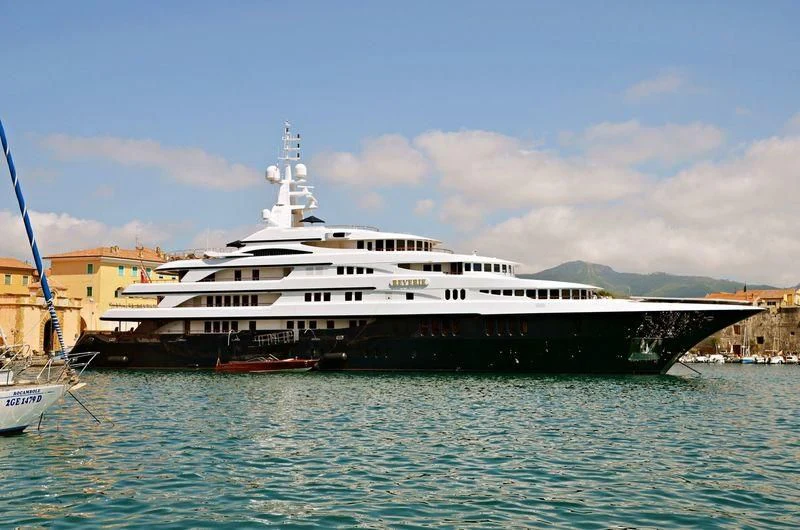 a large cruise ship docked aboard FREEDOM Yacht for Sale