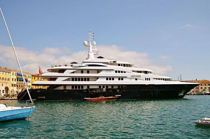 a large white ship docked aboard FREEDOM Yacht for Sale