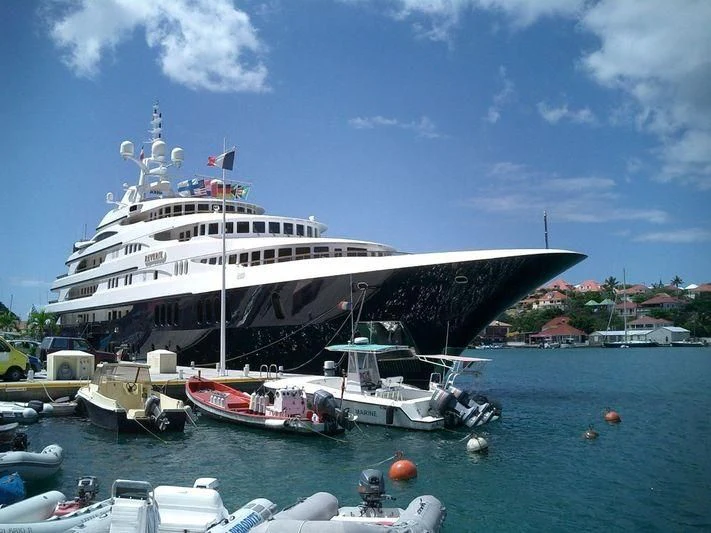 a large cruise ship docked aboard FREEDOM Yacht for Sale