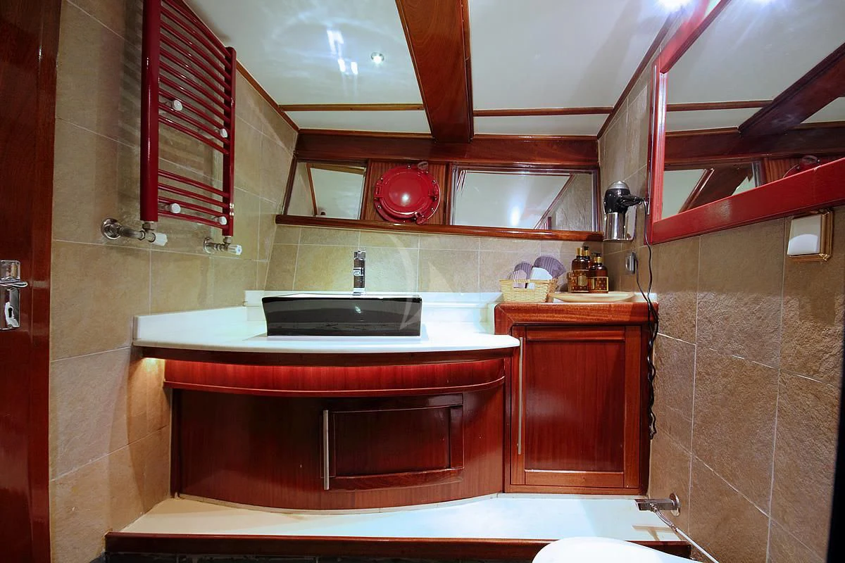 a kitchen with a sink and a mirror aboard NAUTILUS Yacht for Sale