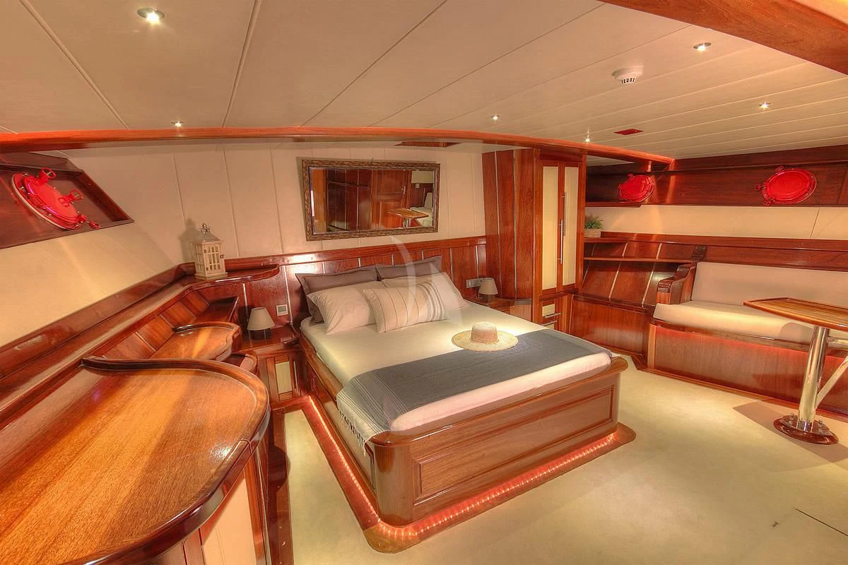 a room with a bed and a couch aboard NAUTILUS Yacht for Sale