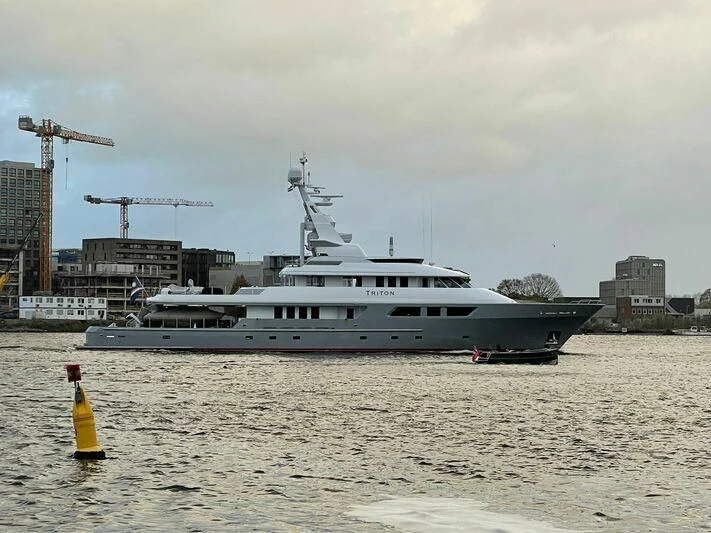 a large ship in the water aboard TRITON Yacht for Sale
