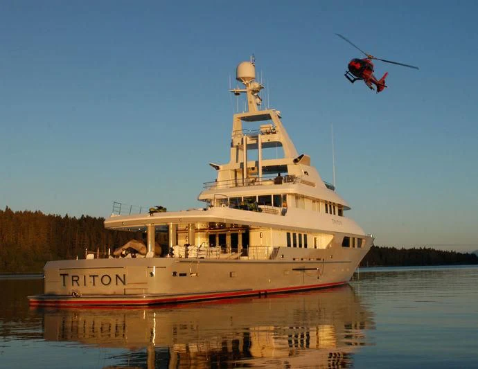 a helicopter flying over a boat aboard TRITON Yacht for Sale