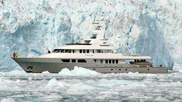 a large boat in the water aboard TRITON Yacht for Sale