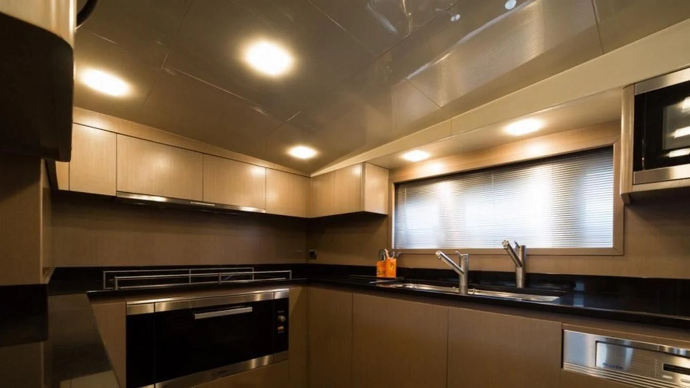 a kitchen with a stove and a sink aboard TRITON Yacht for Sale