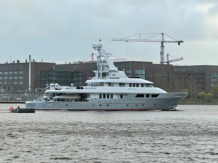a large ship in the water aboard TRITON Yacht for Sale