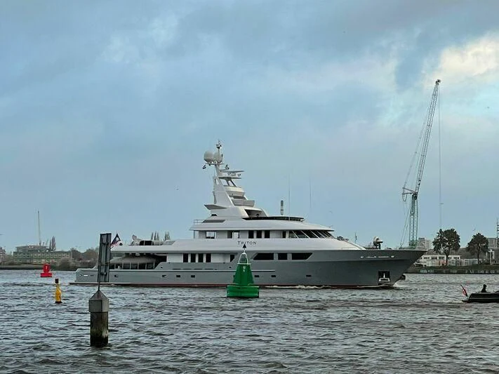 a large boat in the water aboard TRITON Yacht for Sale