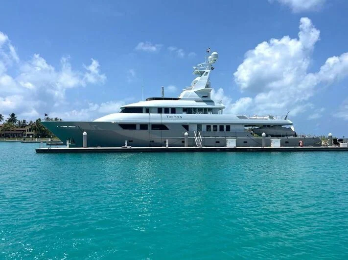 a large ship in the water aboard TRITON Yacht for Sale