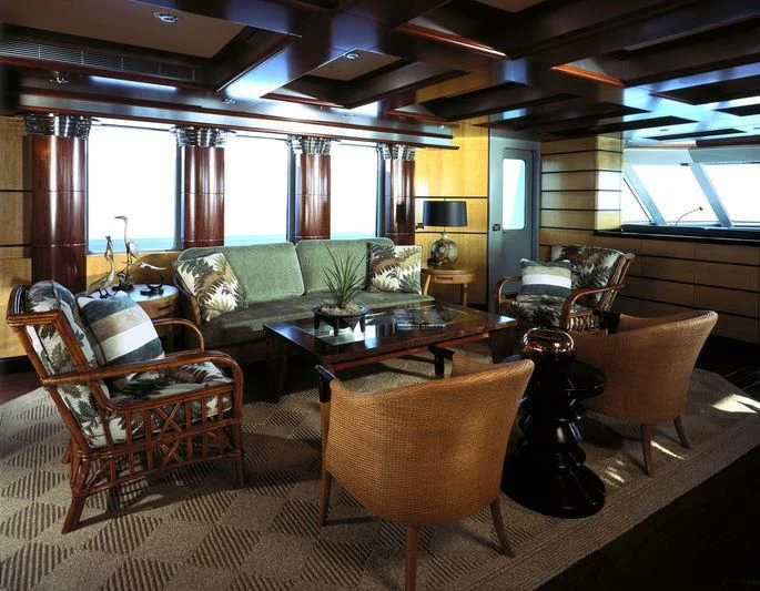 a living room with a couch and chairs aboard TRITON Yacht for Sale