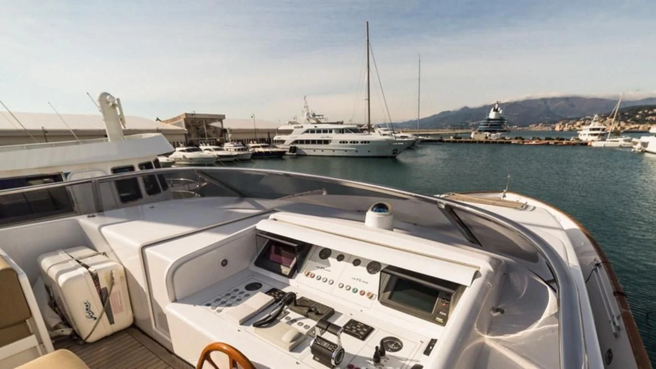 a boat docked at a pier aboard TRITON Yacht for Sale
