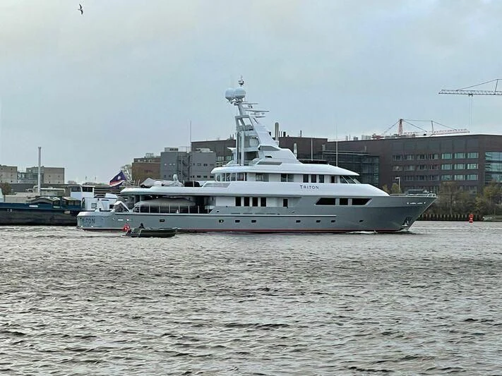 a large white boat in the water aboard TRITON Yacht for Sale