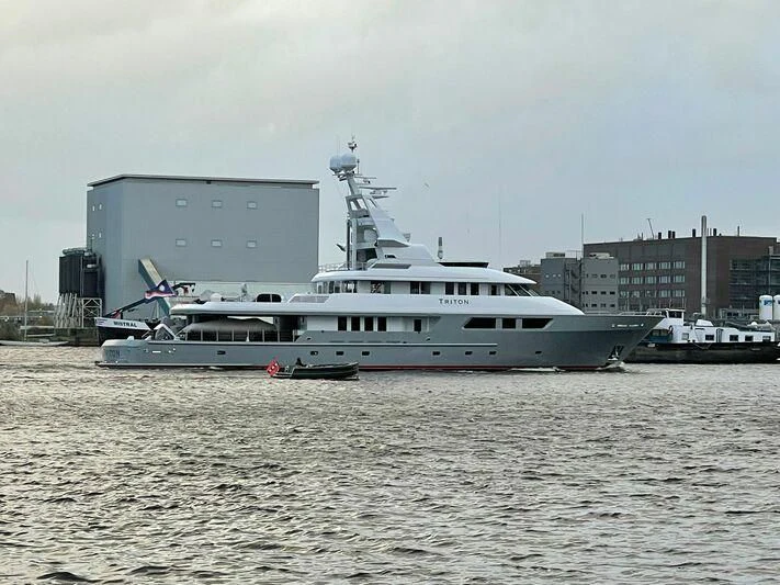a large white boat in the water aboard TRITON Yacht for Sale