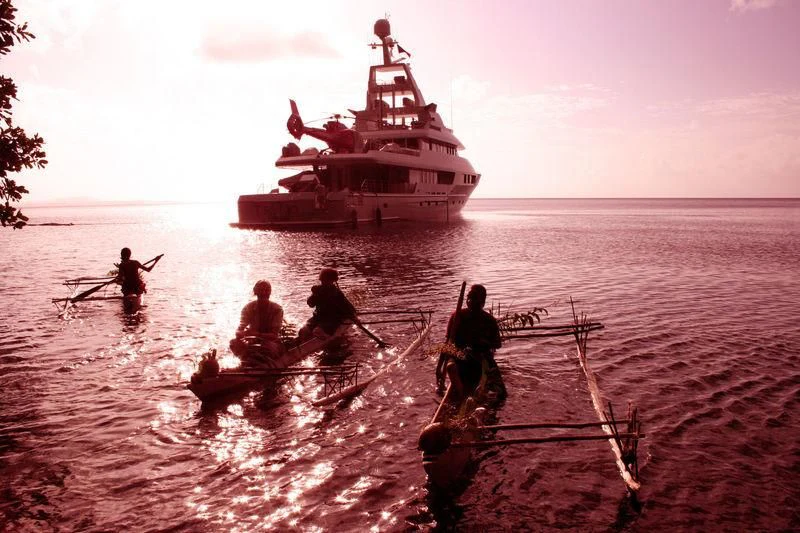 a group of people rowing boats aboard TRITON Yacht for Sale
