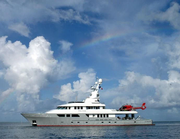 a white yacht in the water aboard TRITON Yacht for Sale