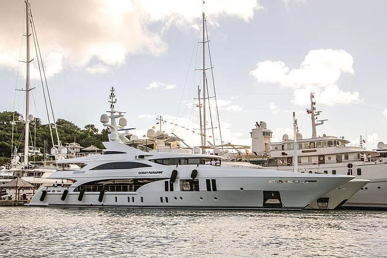 a white boat in the water aboard OCEAN PARADISE Yacht for Sale