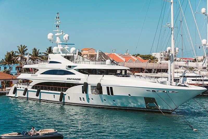 a large white boat in the water aboard OCEAN PARADISE Yacht for Sale