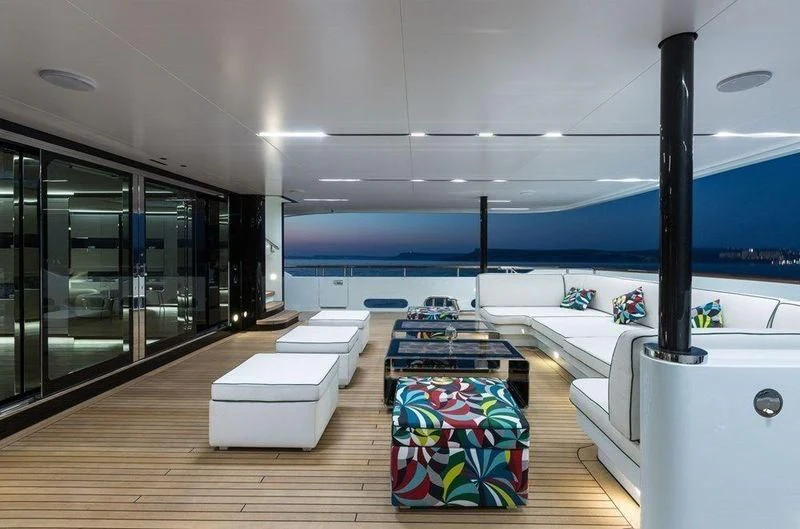 a room with a couch and a pool aboard OCEAN PARADISE Yacht for Sale