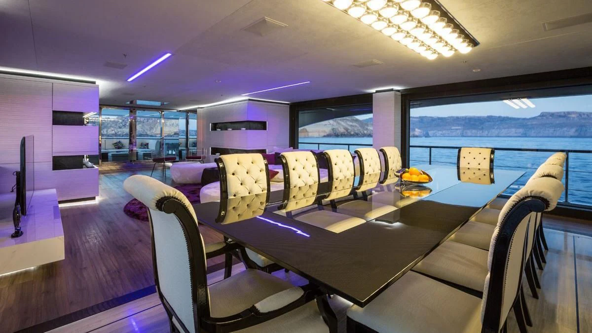 inside of a building with a pool table and chairs aboard OCEAN PARADISE Yacht for Sale