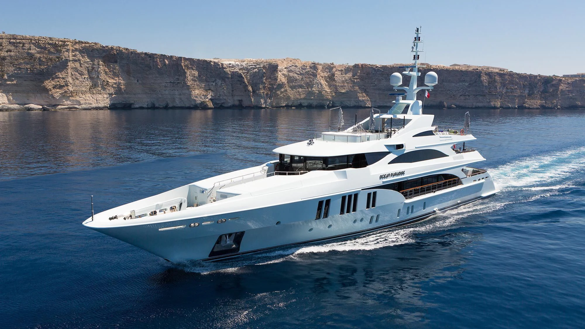 a boat on the water aboard OCEAN PARADISE Yacht for Sale