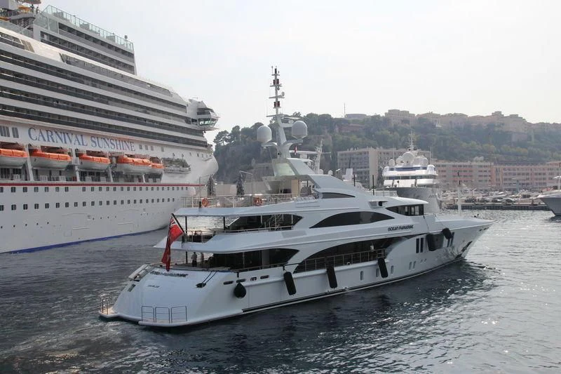 a large white boat in the water aboard OCEAN PARADISE Yacht for Sale