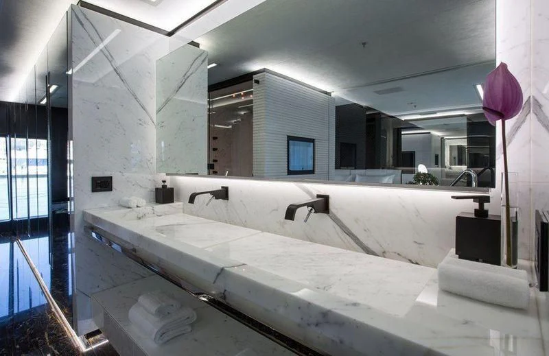 a large bathroom with a large tub aboard OCEAN PARADISE Yacht for Sale