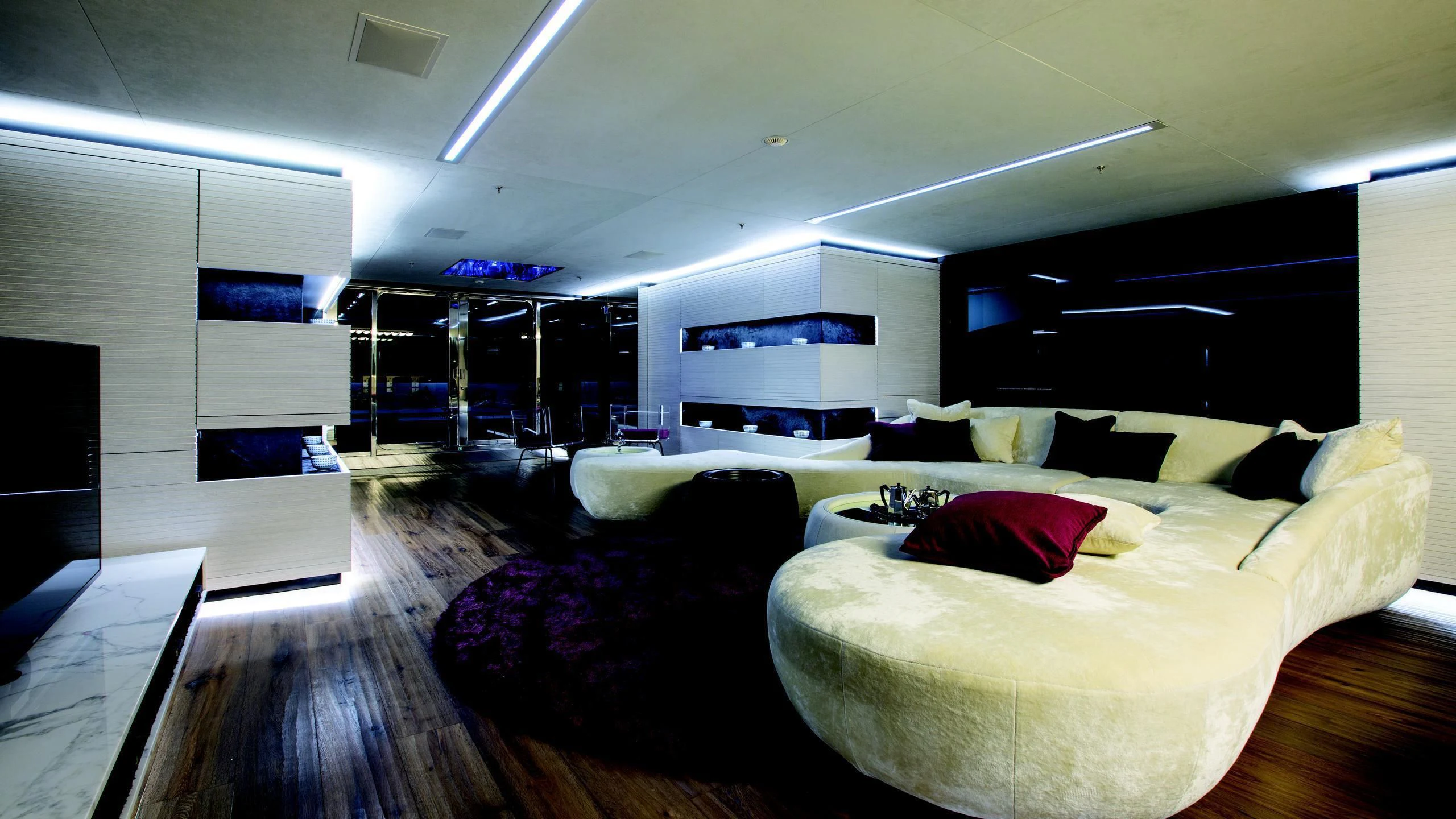 a room with a couch and a tv aboard OCEAN PARADISE Yacht for Sale