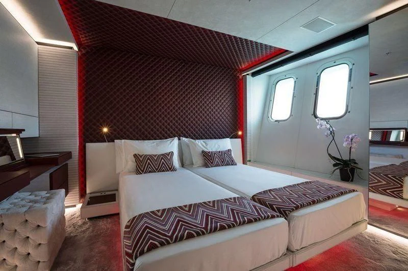 a bed in a room aboard OCEAN PARADISE Yacht for Sale