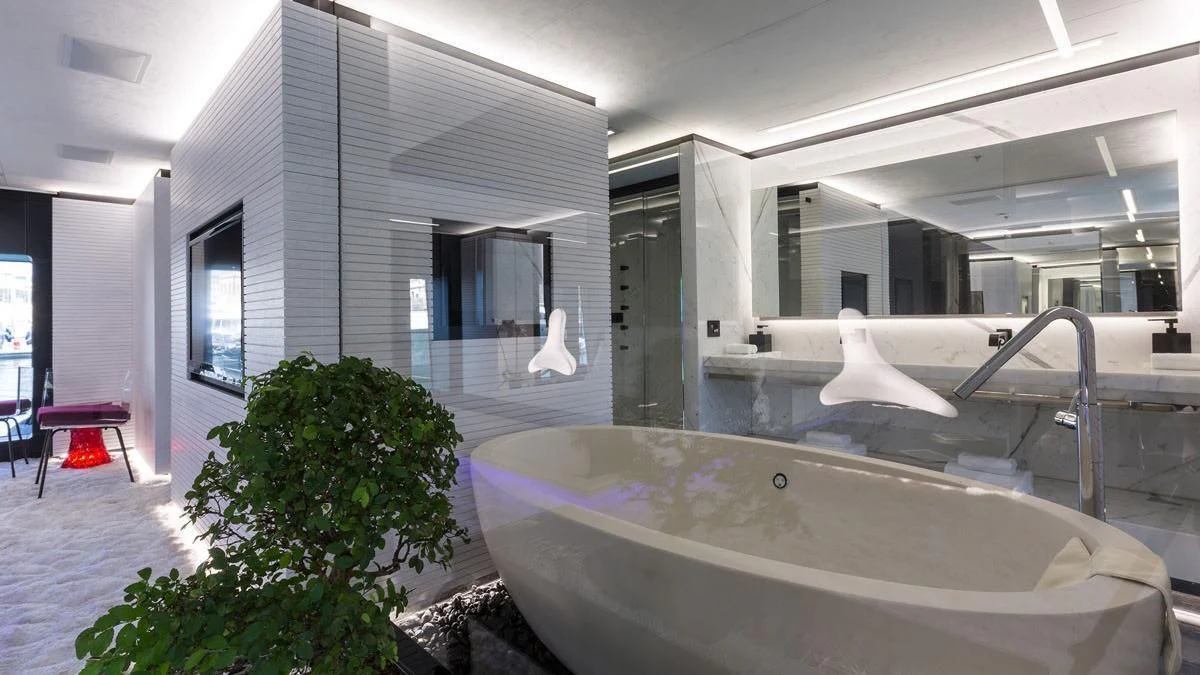 a large jacuzzi in a room with a large window aboard OCEAN PARADISE Yacht for Sale