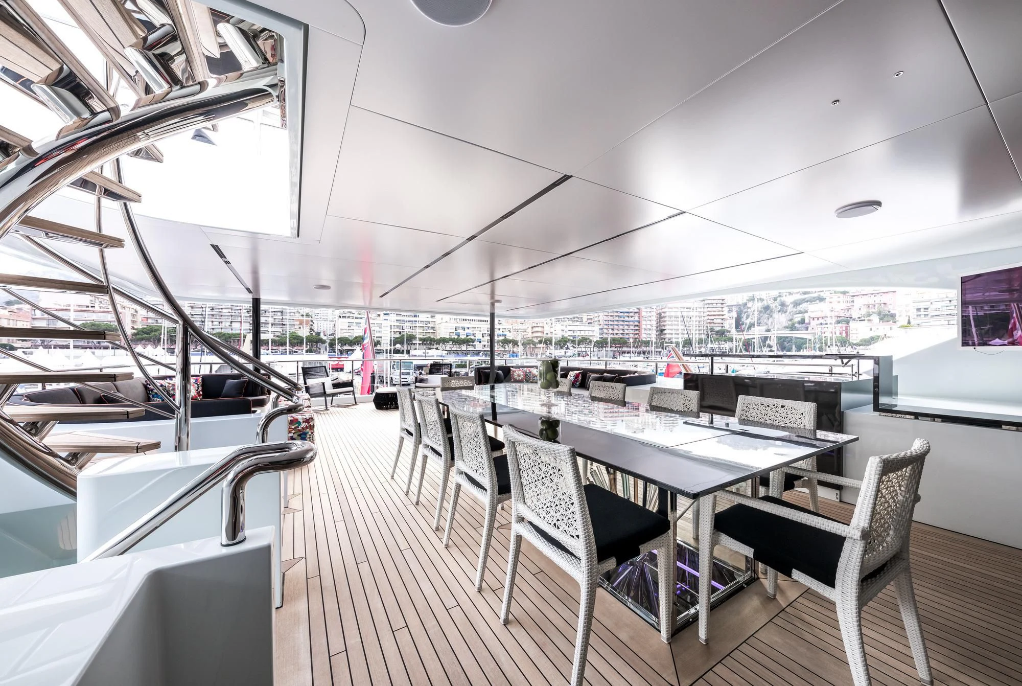 a room with a table and chairs aboard OCEAN PARADISE Yacht for Sale