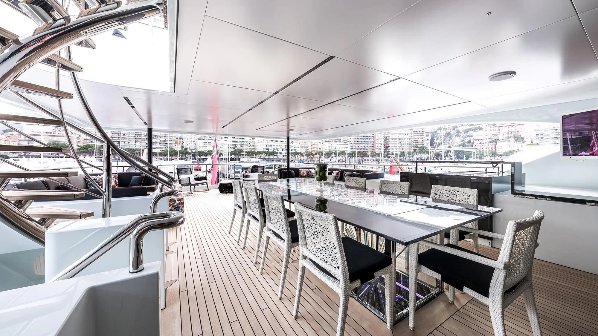 a room with a table and chairs aboard OCEAN PARADISE Yacht for Sale