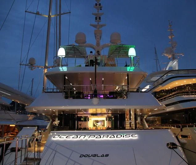 a large boat with a group of people on it aboard OCEAN PARADISE Yacht for Sale
