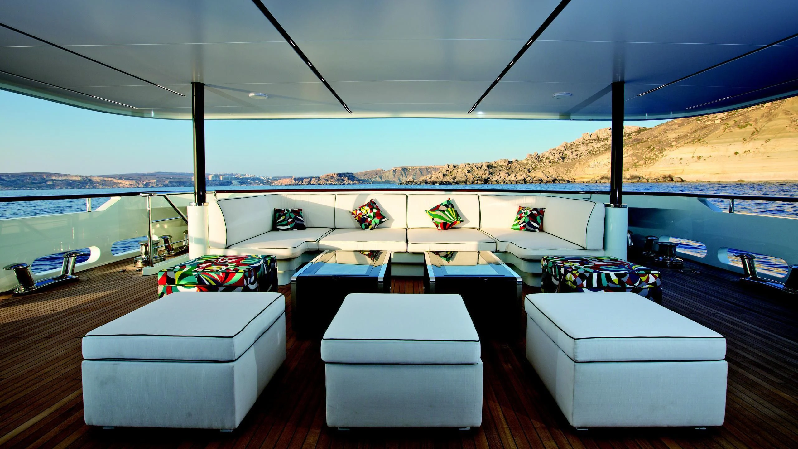 a room with a large window and a view of a body of water aboard OCEAN PARADISE Yacht for Sale