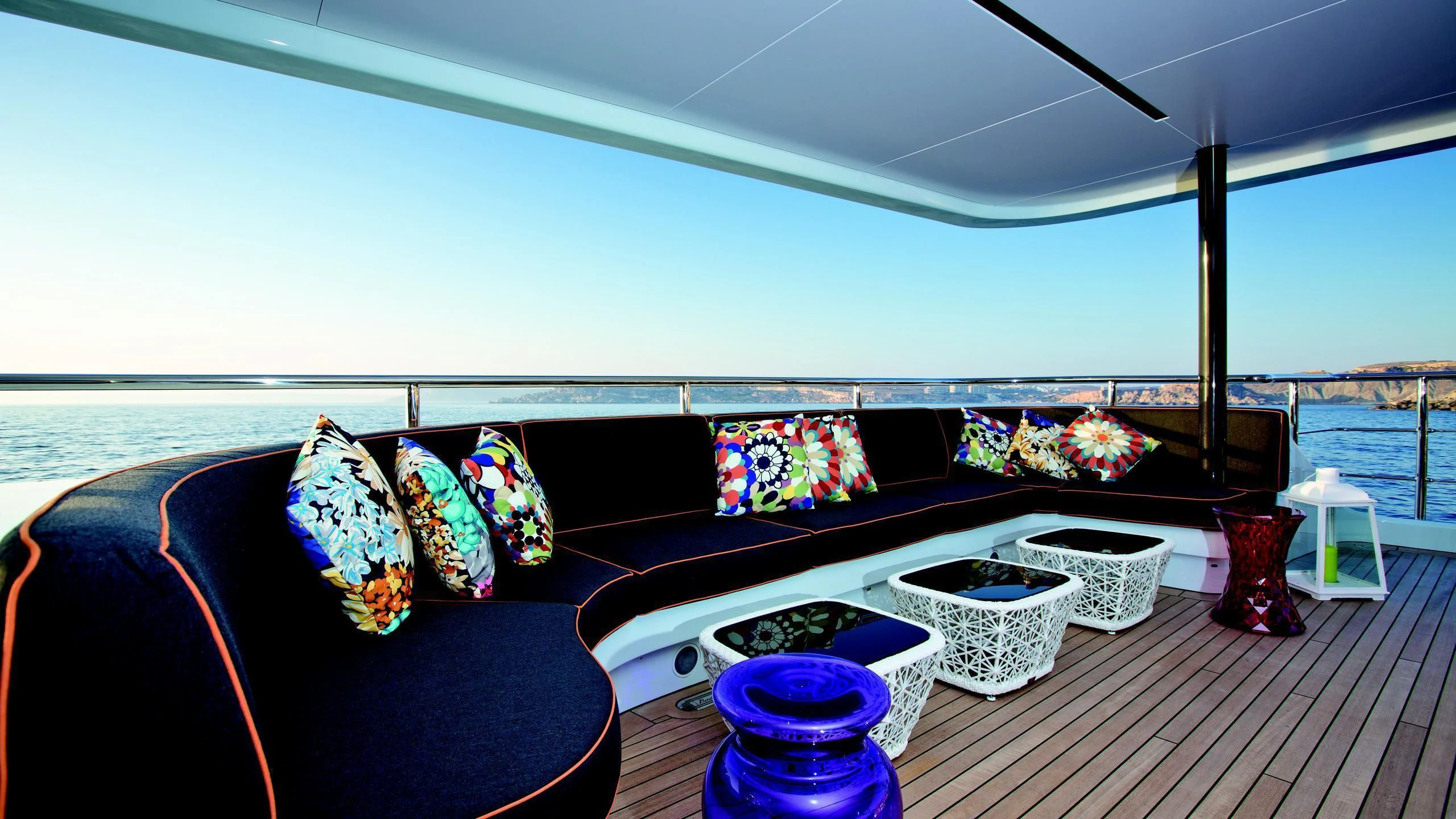 a couch with pillows and pillows aboard OCEAN PARADISE Yacht for Sale