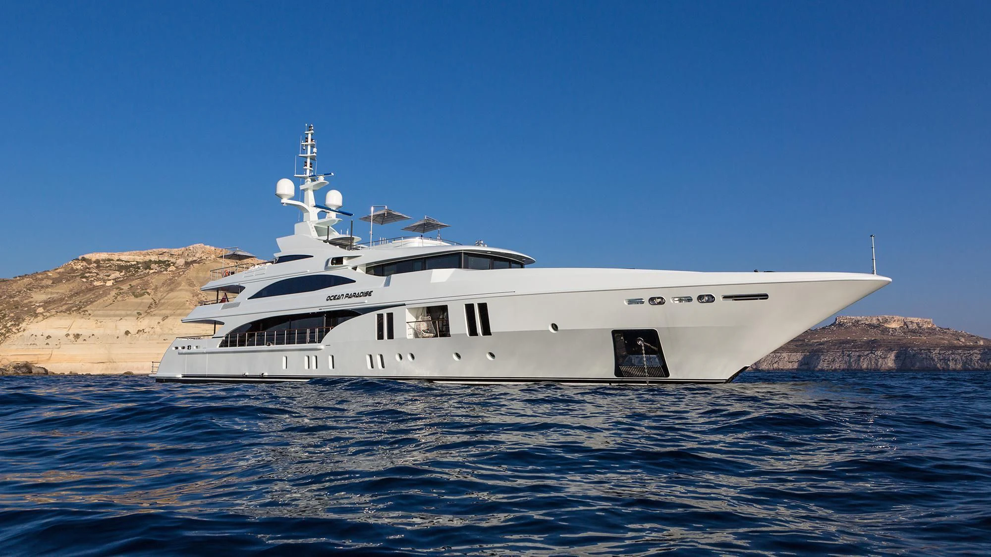a white yacht in the water aboard OCEAN PARADISE Yacht for Sale