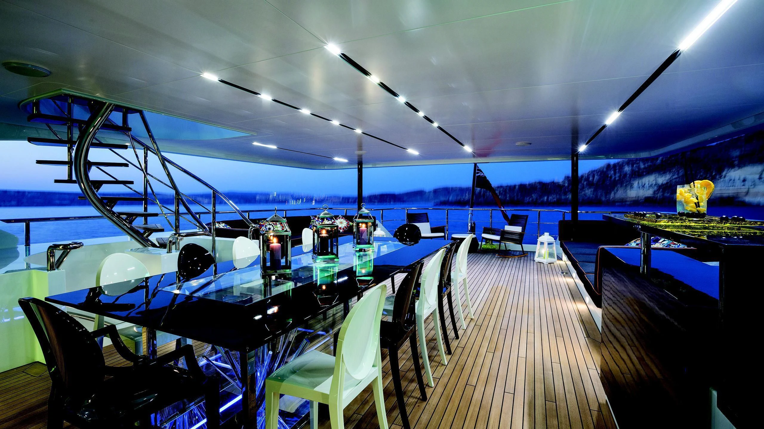 a room with a table and chairs aboard OCEAN PARADISE Yacht for Sale