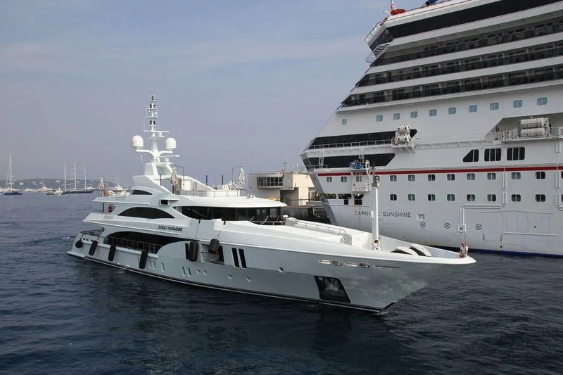 a couple of large white boats in the water aboard OCEAN PARADISE Yacht for Sale