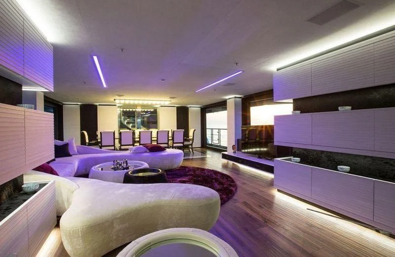 a room with a couch and a table aboard OCEAN PARADISE Yacht for Sale