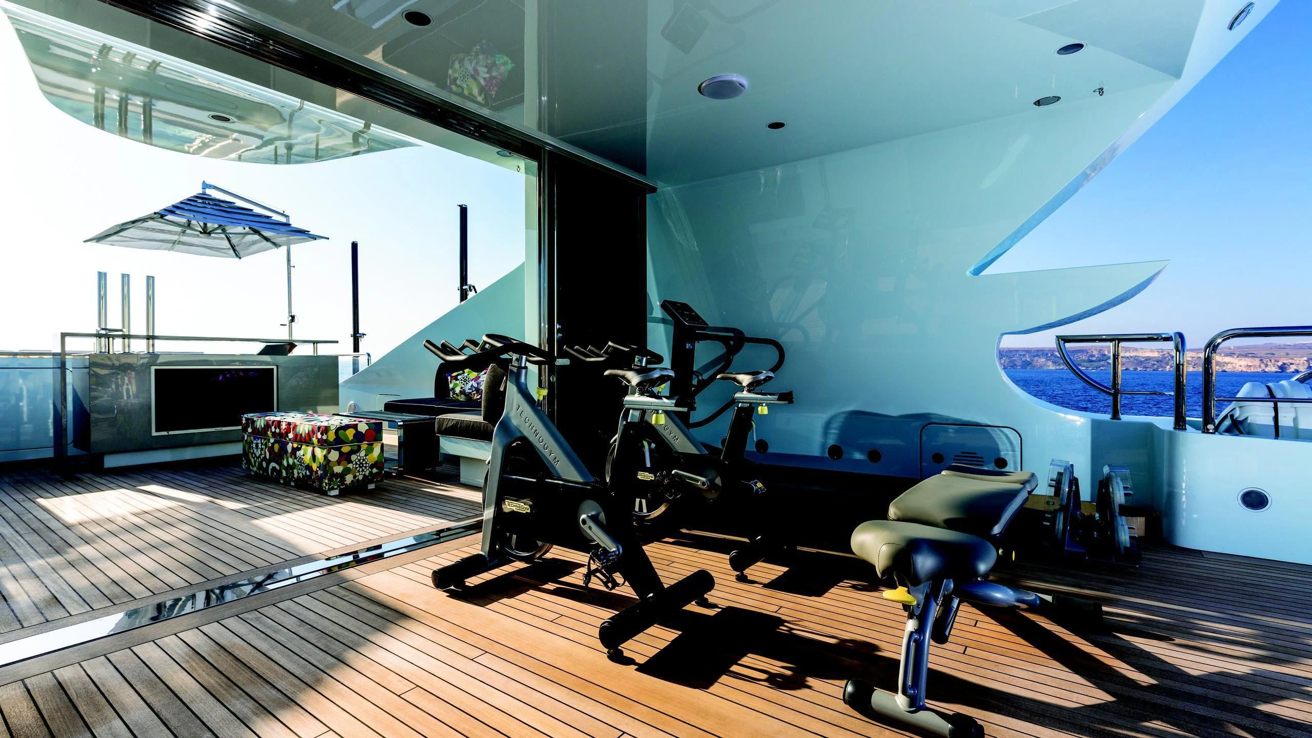 a room with a pool table and chairs aboard OCEAN PARADISE Yacht for Sale
