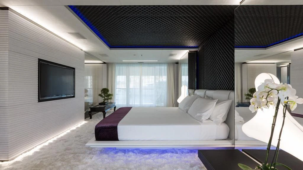 a room with a bed and a tv aboard OCEAN PARADISE Yacht for Sale