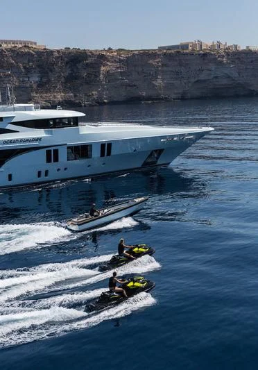 a group of people on a boat in the water aboard OCEAN PARADISE Yacht for Sale