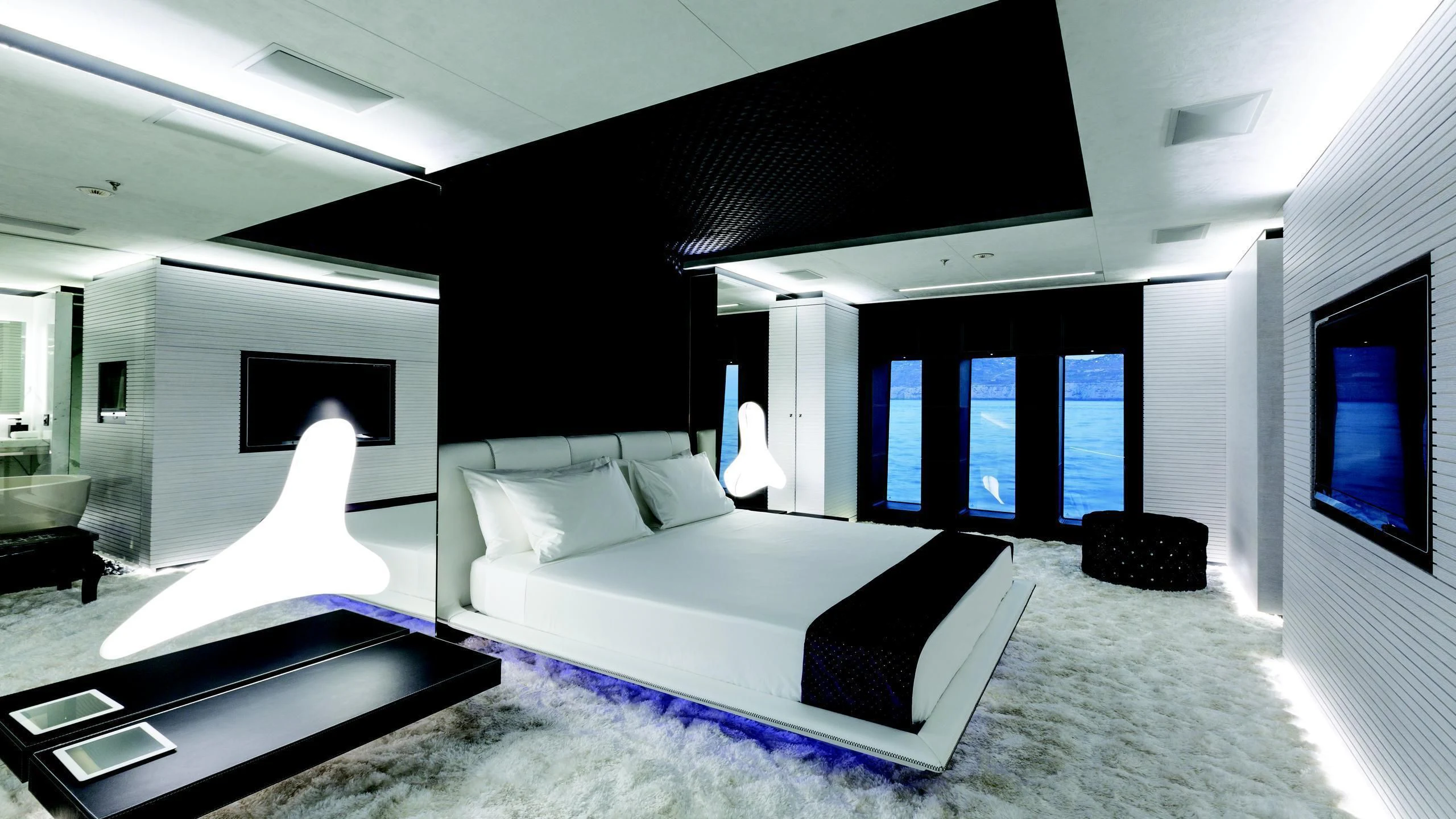 a room with a bed and a tv aboard OCEAN PARADISE Yacht for Sale