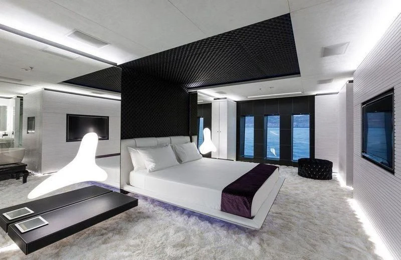 a room with a bed and a tv aboard OCEAN PARADISE Yacht for Sale